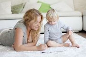Family sitting on nicely cleaned carpet