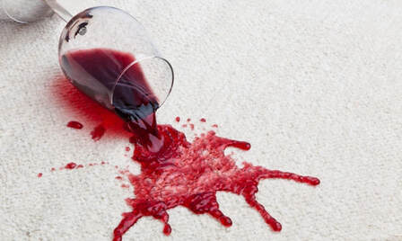 red wine stain on white carpet