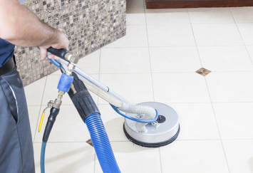 professional tile and grout cleaning equipment in bathroom